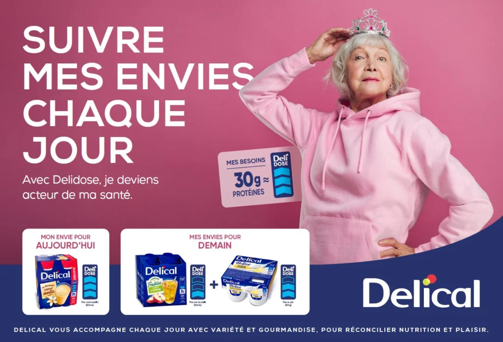 Image de couverture d'une formation sur l'outil Delidose de Delical. Une personne en sweat rose tient une couronne sur sa tête, sur fond rose avec le texte : 'Suivre mes envies chaque jour – Avec Delidose, je deviens acteur de ma santé'. L’image inclut des repères nutritionnels, des produits Delical, et le slogan : 'Delical vous accompagne chaque jour avec variété et gourmandise, pour réconcilier nutrition et plaisir'.